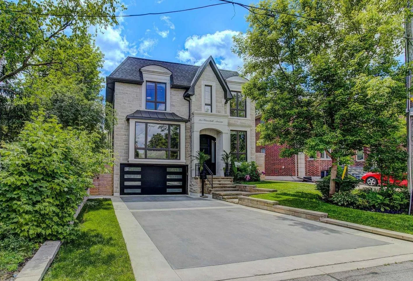 Kaizen Construction Group — custom home exterior with deck and landscaped backyard