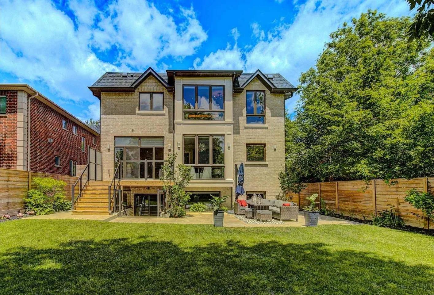 Kaizen Construction Group — custom home rear with landscaped yard
